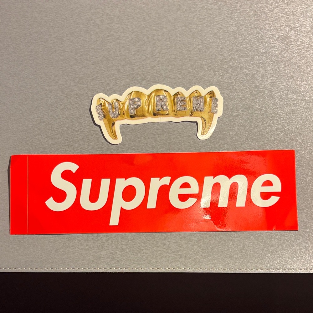 Supreme Red Sticker with Gold and Silver Grillz